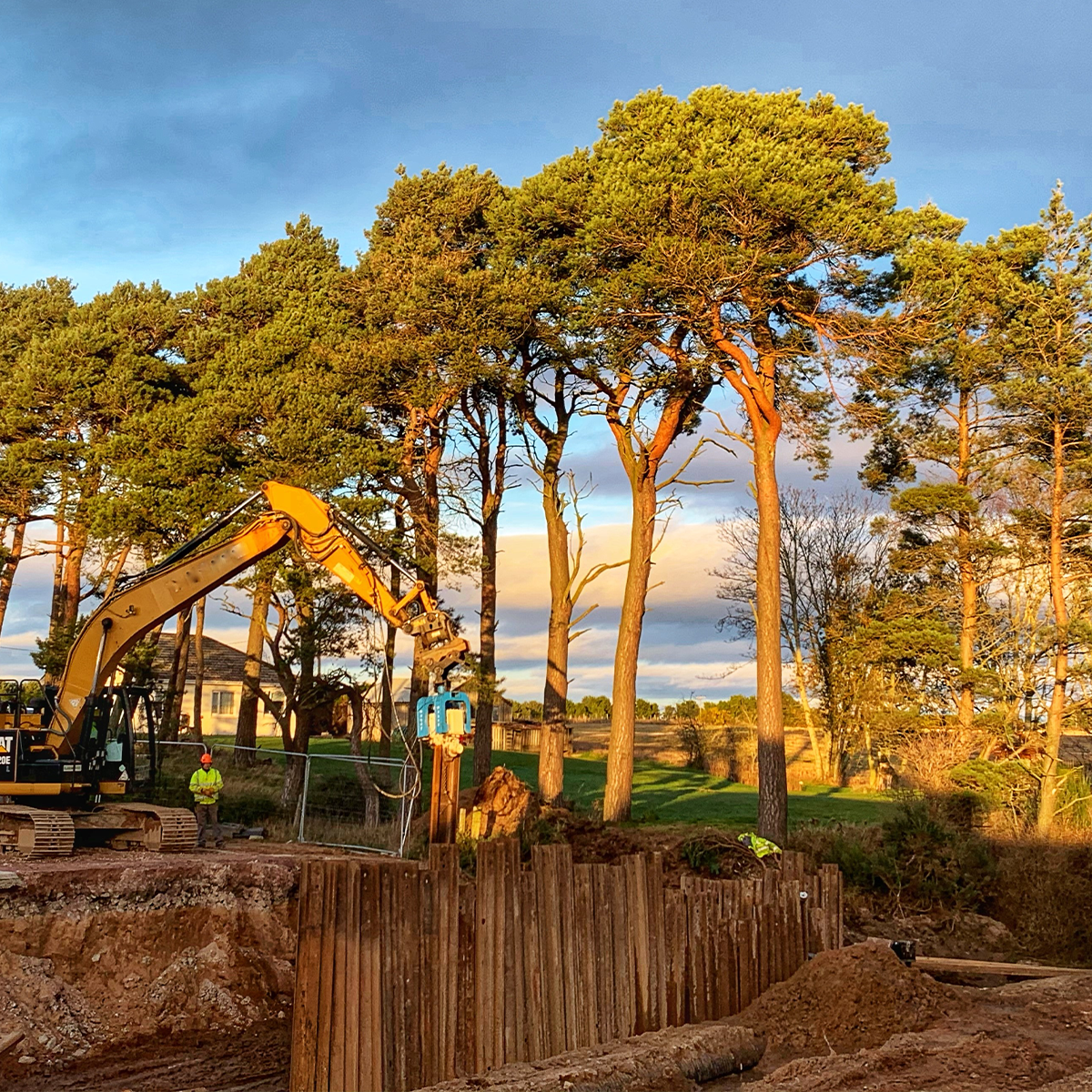 Mabey Hire excavator mounted vibrator (EMV) on site in woodland
