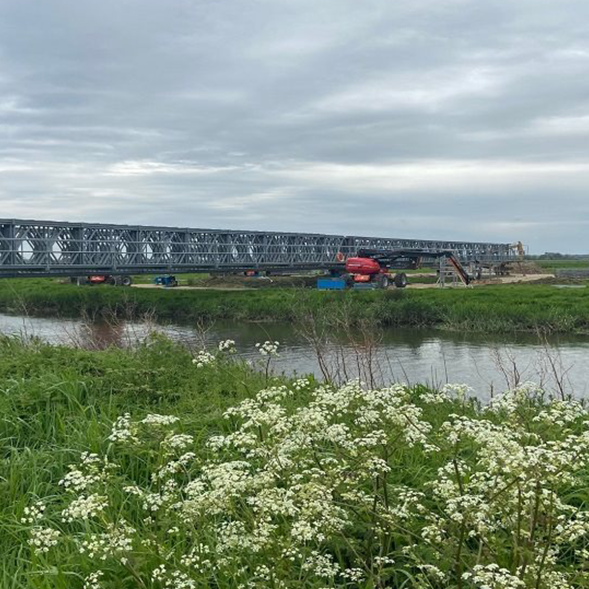 Mabey Hire compact 200 panel bridge over water next to fields