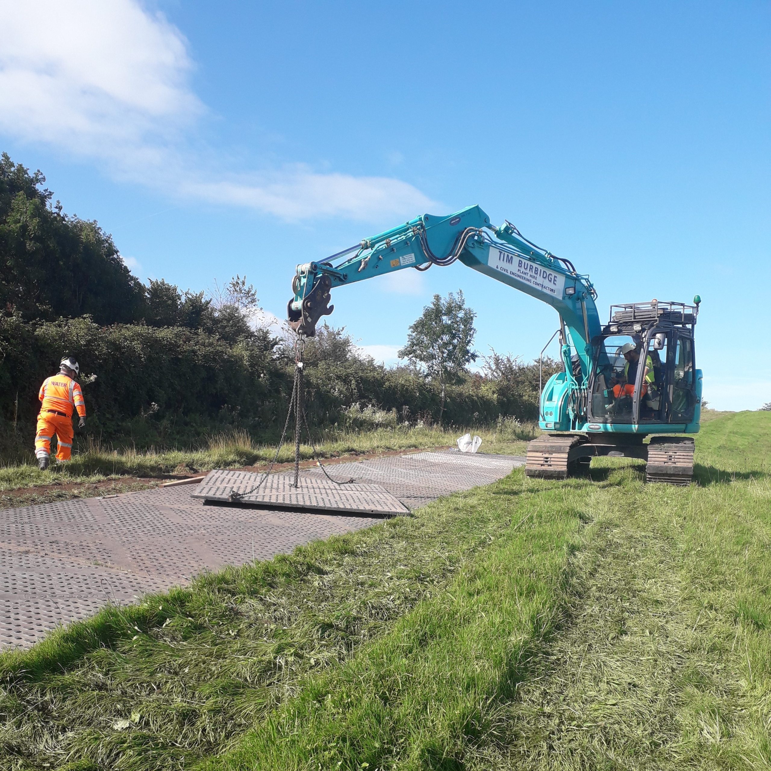 TuffTrak ground protection mat on site being listed into place